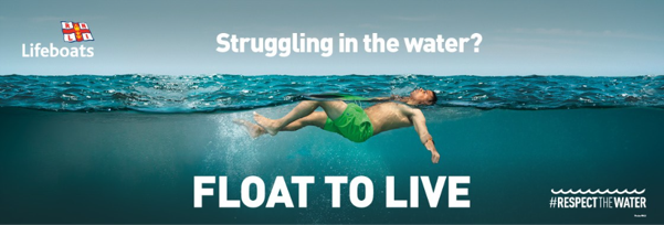 A photograph of a man floating on his back in the water.