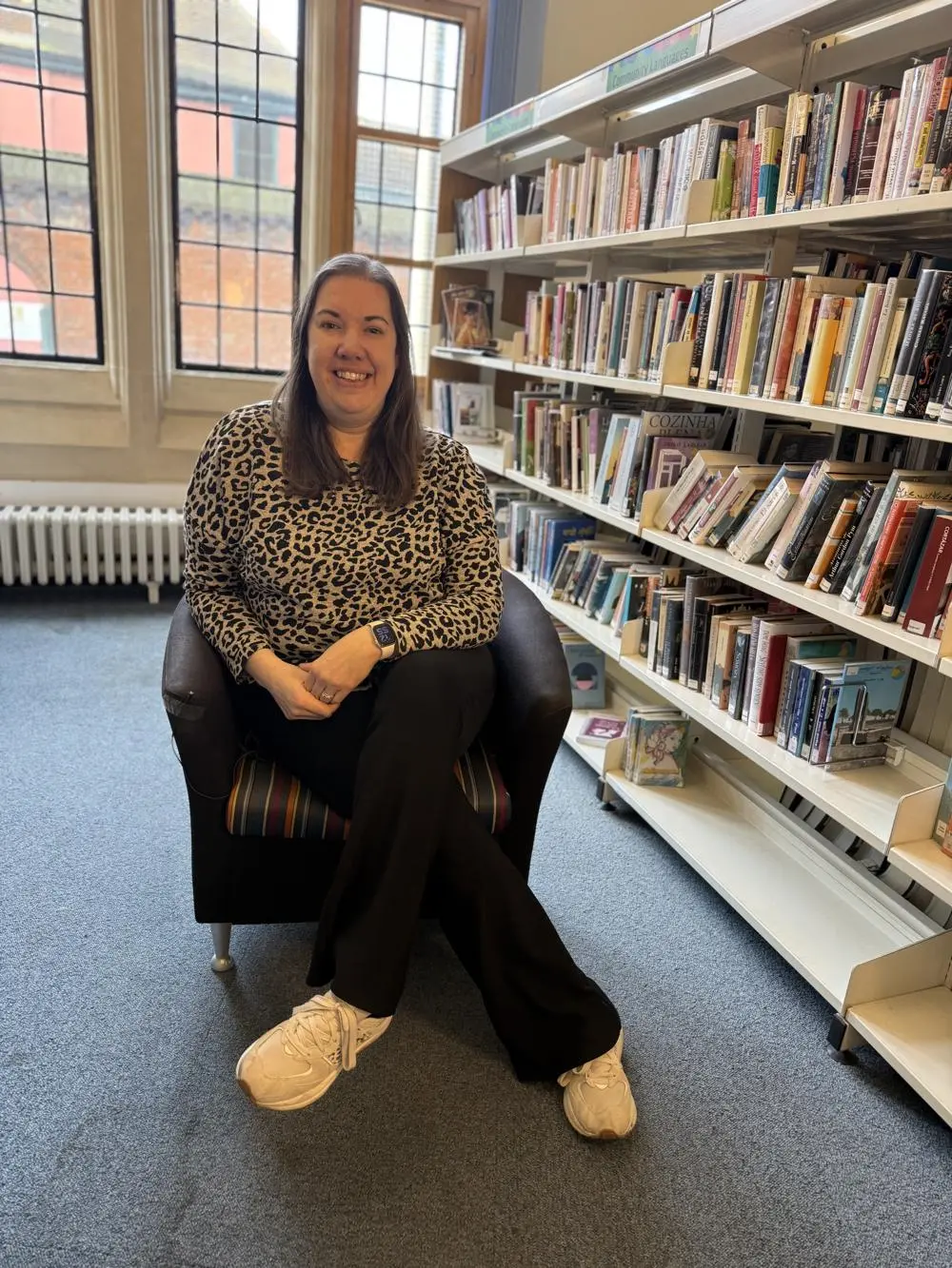Kate sat in a chair at the Ipswich Library.