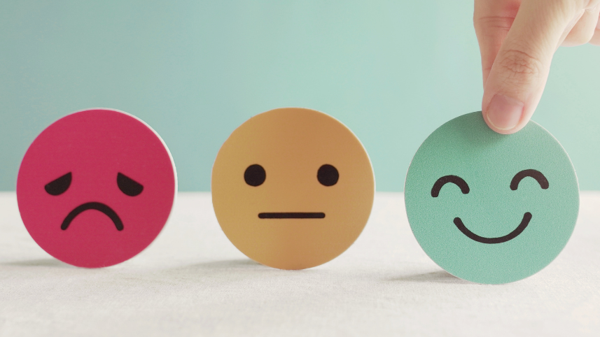 Three face emojis, unhappy, neutral and happy.