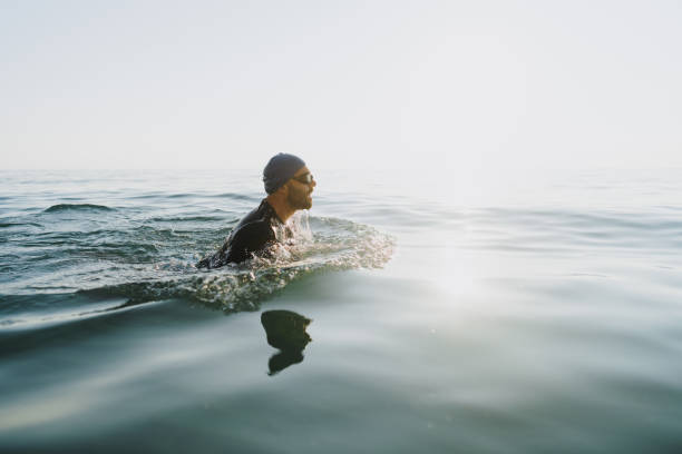 A man swimming in a lake