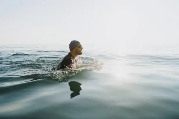 A man swimming in a lake