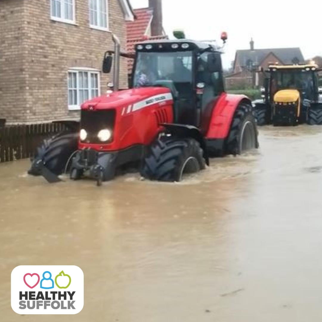 A tractor helping during the emergency response to Storm Babet in Suffolk
